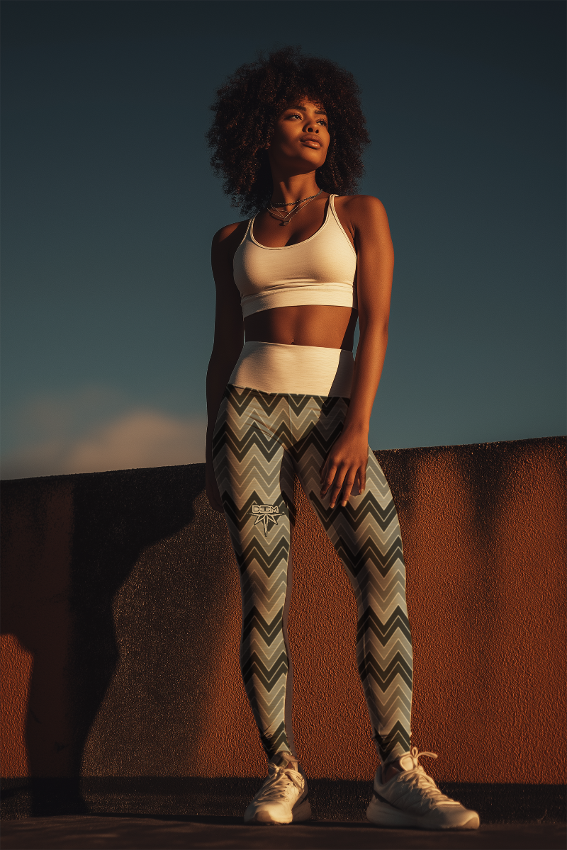 Woman in athletic wear standing on a rooftop with a sunset background